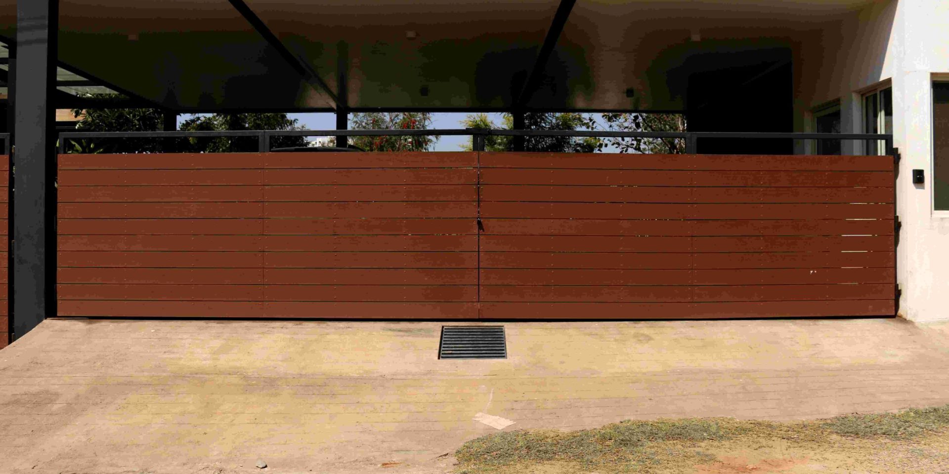 Stylish wood-finish WPC gate for modern, durable home exteriors.