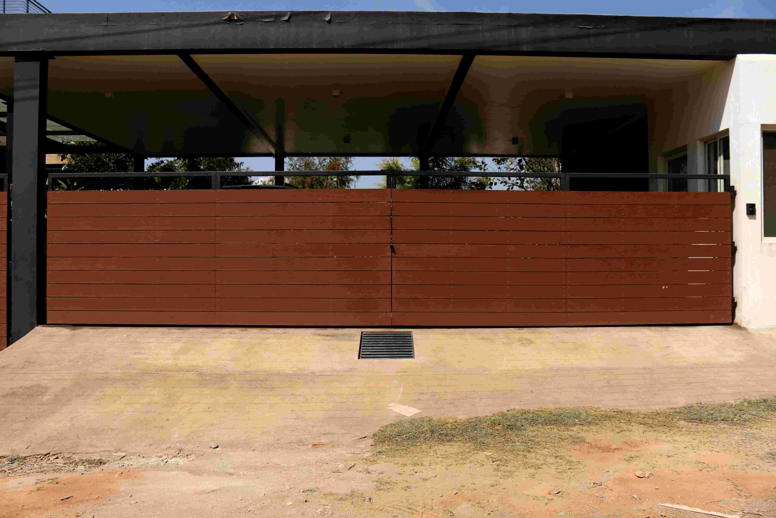 Stylish wood-finish WPC gate for modern, durable home exteriors.