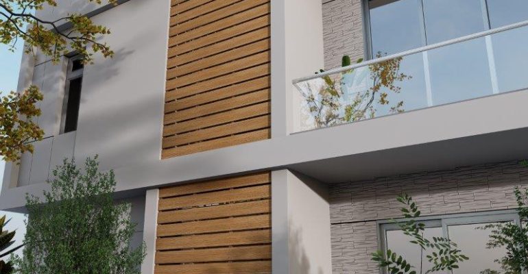 Modern two-story building facade featuring gray stucco, wooden slat panels, and large windows with a glass balcony railing.