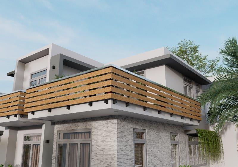 Modern two-story house with a wooden railing balcony and gray stone exterior under a blue sky.